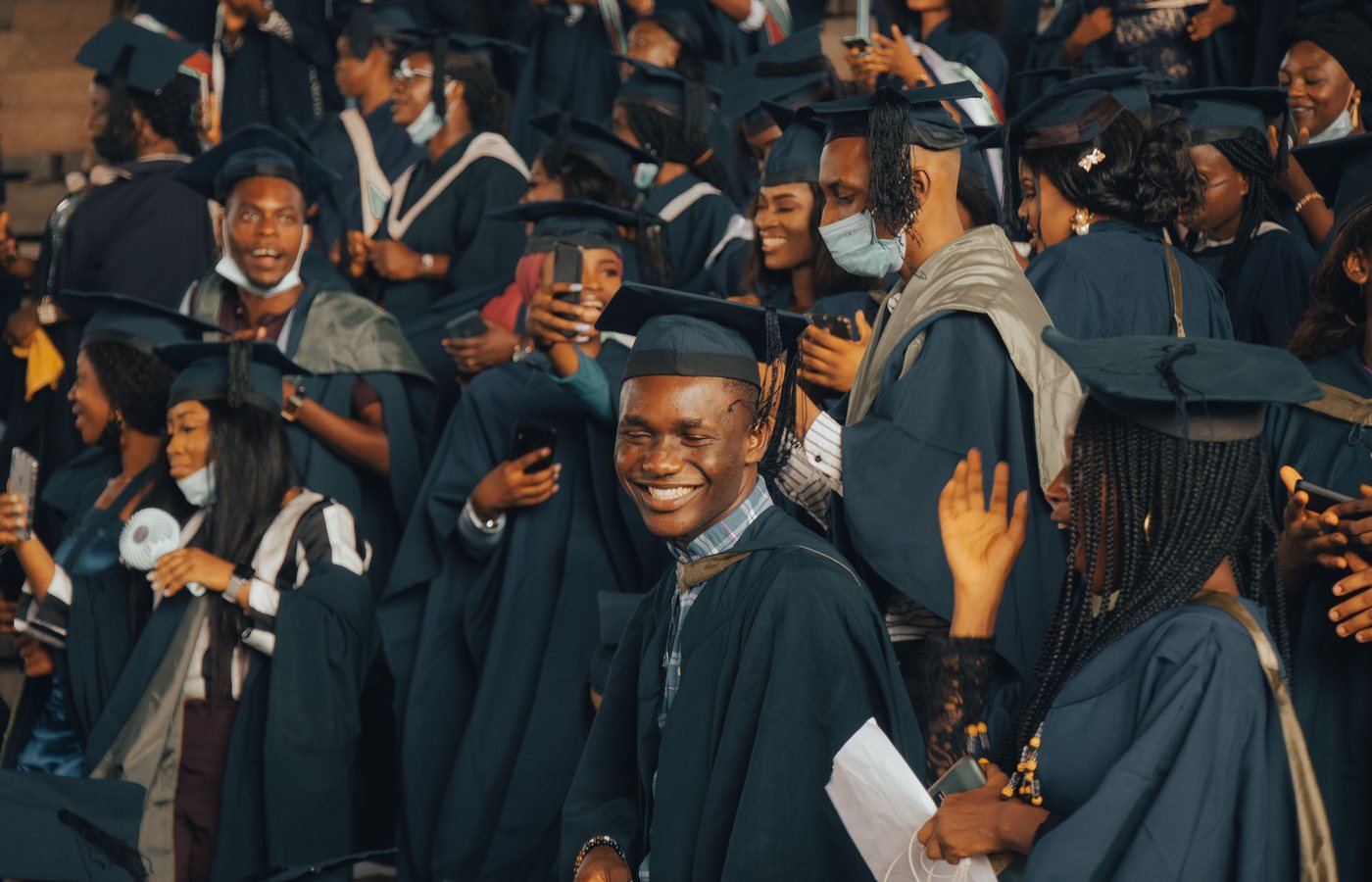 African graduates celebrating at a university ceremony