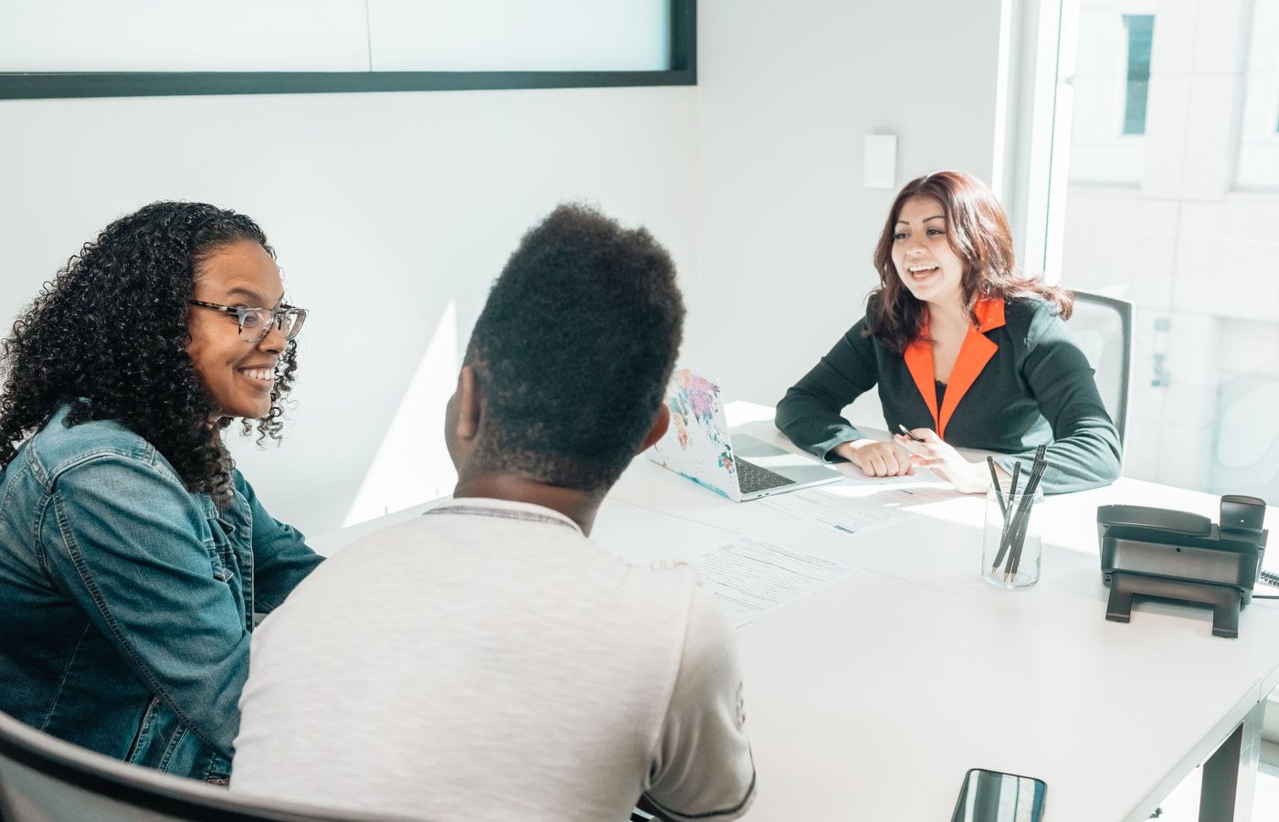 An advisor meeting with prospective students during a consultation